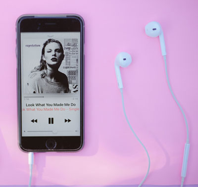 iOS 14 on an iPhone with a Taylor Swift song playing